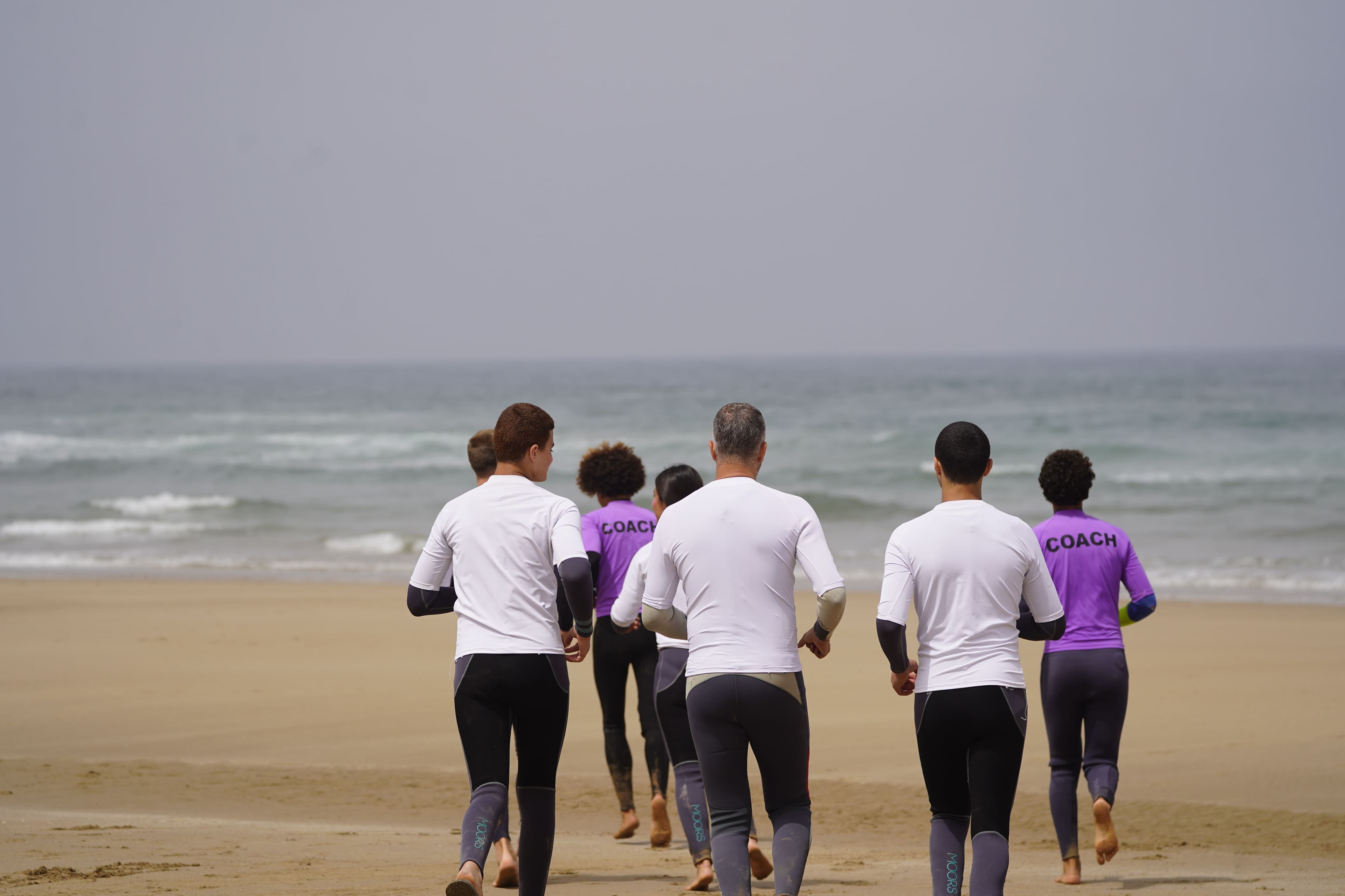 Woodstock surf group beginning a beach warm-up together