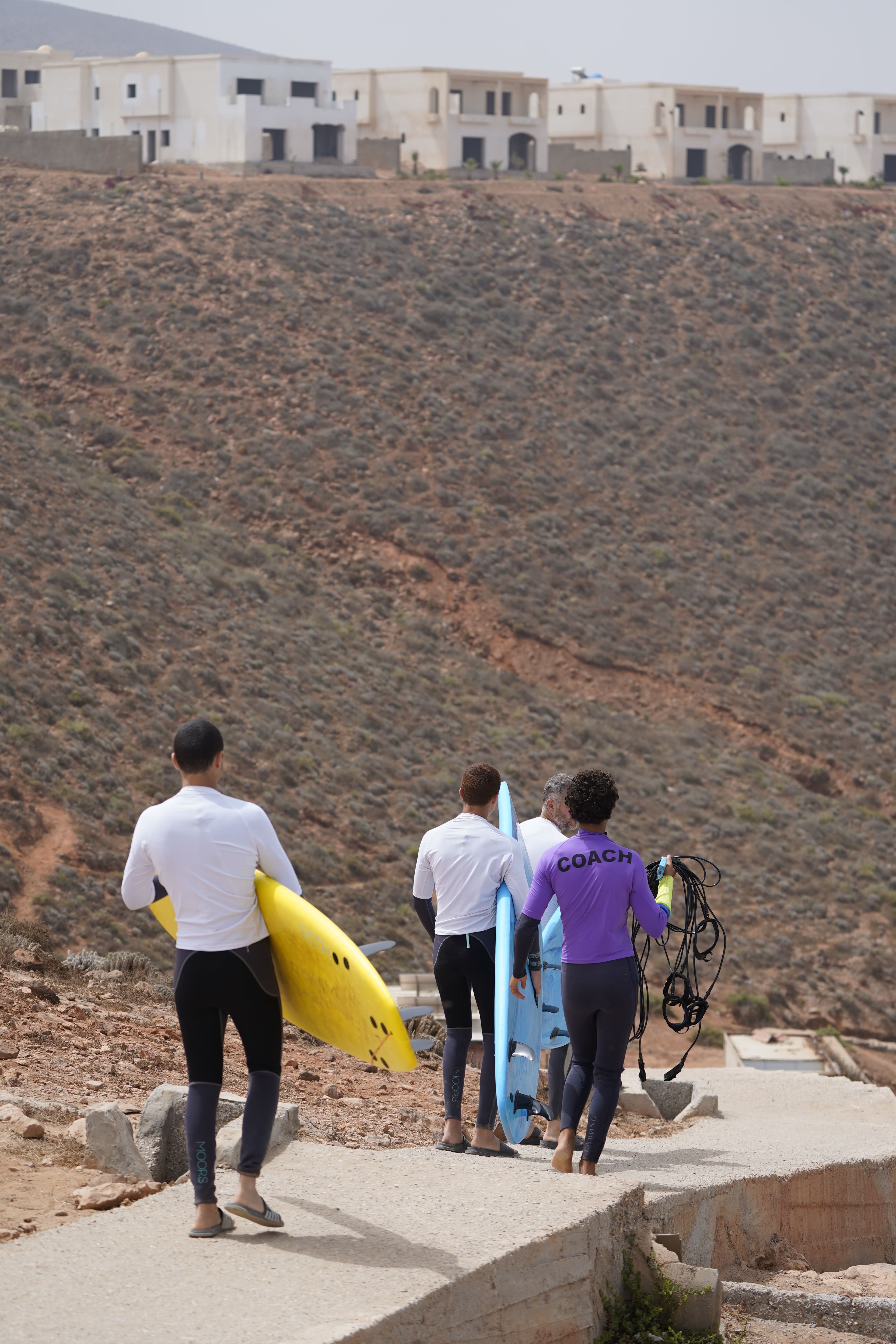 Woodstock surf group walking to the beach with their boards