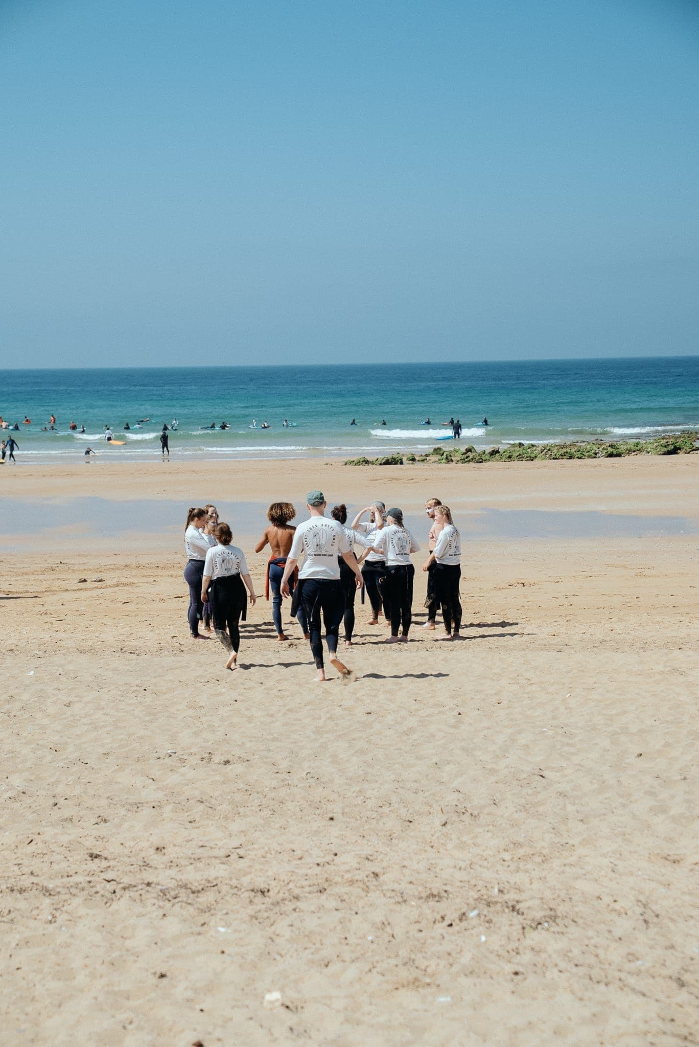Woodstock surf group walking to the beach with their boards
