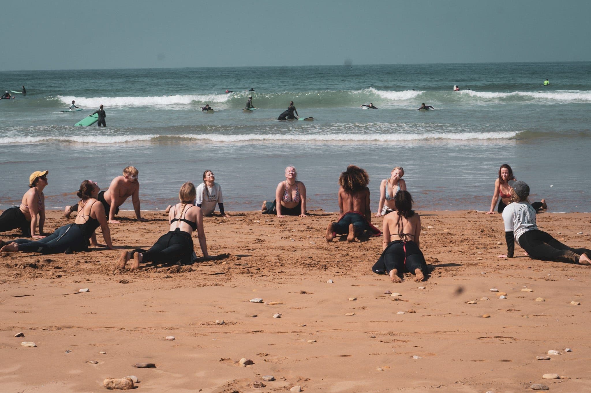Woodstock surf group walking to the beach with their boards